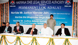 The Chief Justice of the Punjab and Haryana High Court, Justice Vijender Jain, and Haryana Chief Minister Bhupinder Singh Hooda at the inauguration of the permanent lok adalat in Rohtak on Wednesday.