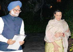 Prime Minister Manmohan Singh with AICC President Sonia Gandhi on way to attend the CWC meeting in New Delhi