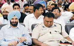 Patiala SSP S.K. Asthana sleeps as Patiala deputy commissioner D.S. Grewal watches at the Founders Day function of Punjab Public School in Nabha