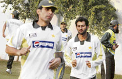 Misbah-ul-Haq, Younis Khan and Shoaib Malik warm up on Wednesday ahead of the second one-day international between India and Pakistan at the PCA Stadium in Mohali