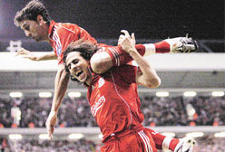 Liverpools Yossi Benayoun (right) celebrates with team-mate Alvaro Arbeloa after recording a hat-trick against Besiktas during their Champions League soccer match at Anfield