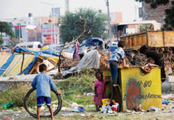 Children play at a garbage dump in Karnal oblivious of the danger to their health