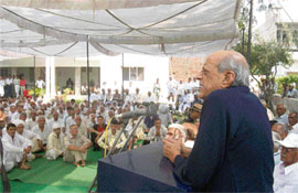 A former union minister, Col Ram Singh, addresses a conference of his supporters at Rewari recently.
