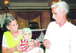Sri Loku Ram and his wife Sheila Devi with their daughter Mishthi. 