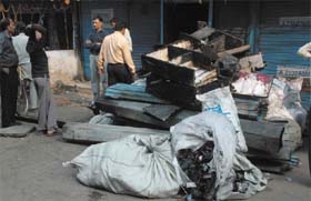 Burnt cotton bales of a shop at Rui Mandi (Sadar Bazar) where a fire damaged cotton in the Capital on Friday night