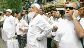 Investors watch the benchmark Sensex of the Bombay Stock exchange as it joined the 20,000 club.