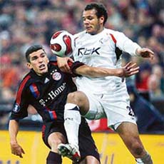 Bayern Munichs defender Lucio (L) vies with Bolton Wanderers forward Daniel Braaten during their UEFA group F match in Munich
