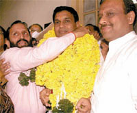 BJP councillor Divya Jayaswal being garlanded by Leader of the House, MCD Subhash Arya (L), after filing his nomination forms for the post of Deputy Mayor in the Capital on Monday.