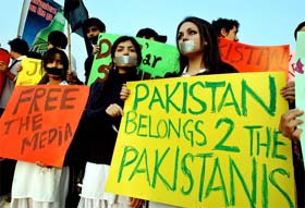 Pakistani student hold placards during a demonstration in Islamabad