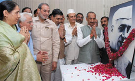 DPCC president J.P. Aggarwal with MPs paying tributes to Pandit Jawaharlal Nehru at DPCC office on his 118th birth anniversary in the Capital on Wednesday.