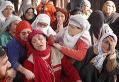 Relatives wail over the body of National Conference councillor Ghulam Nabi Wani who was shot dead by militants at Khanyar in Srinagar