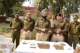 SP A.S.Chawla (centre) with the ammunition recovered from a scrap dealer in Karnal