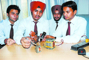 Students of the CT Institute of Engineering and Technology demonstrate the working of a system that uses wireless electricity in Jalandhar on Thursday.