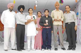 Meritorious students of Amloh Public School receiving awards in Amloh