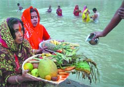 Devotees performing rituals on the occasion of Chhath Puja in Bathinda on Friday.