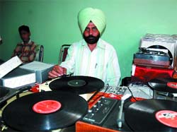 Baljinder Singh of Bhagta Bhai Ka village shows his collection of records on Friday. 