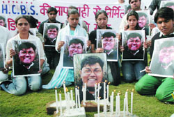 Relatives and friends of Mayank Gulati who lost his life at the HCBS crossing, demand justice outside the HCBS office in the Capital 