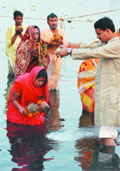 Devotees perform rituals on the occasion of Chhath Puja in the Yumuna Pusta in the Capital