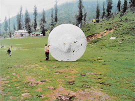 The zorb goes rolling down the slope at Solang.