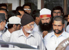Dera Sacha Sauda head Gurmeet Ram Rahim Singh comes out of the CBI court in Ambala city on Saturday.