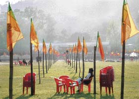 A BJP worker oversees preparations for the BJP rally to be held in Mandi