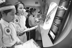 Students look at items on display in the Science Express, in Jammu on Saturday.