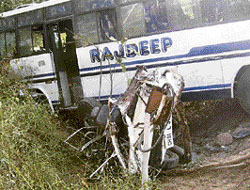The mangled remains of the car that collided with a bus near Gharuan in Kharar on Sunday. 