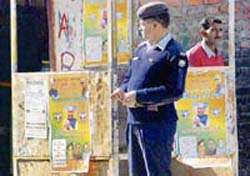 A traffic booth defaced by BJP posters in central Mandi in violation of the poll code.