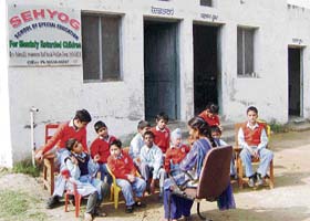 Differently- abled children with their teacher in the Sehyog School of Special Education at Sangrur