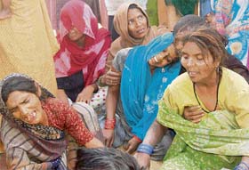 Relatives of Rajesh wail over his death at the Bilongi barrier in Kharar