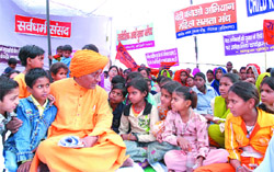 Social activist Swami Agnivesh and under-privileged children protests against TV programmes inimical to the building of scientific temper near Parliament House in the Capital
