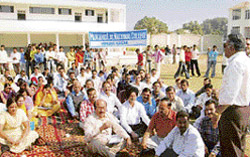 College teachers sit in dharna in protest against the attack on a lecturer, Dr Sanjiv Chaudhary, at MLN College, Yamunanagar,