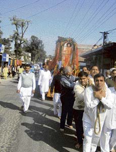 Followers of Satya Sai Baba take out a shobha yatra at Kangra on Tuesday in connection with the 82nd birthday of the Baba falling on November 23