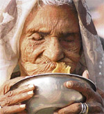 A elderly woman struggles with a morsel on a cold Tuesday morning in Ludhiana