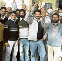 BSNL employees raise slogans outside the office of the general manager, Dharamsala, in support of their demands on Wednesday.