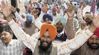 PSEB employees protest at the Mohali branch office on Wednesday.