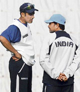 Indian captain Anil Kumble talks with teammate Sachin Tendulkar during a training session at the Ferozeshah Kotla ground in New Delhi on Wednesday.
