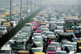 Traffic moves at a snails pace on Vikas marg due to the ongoing India International Trade Fair and Indo-Pak cricket test match in the Capital on Thursday.
