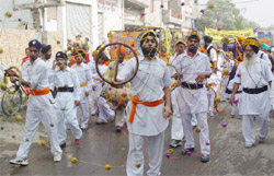 Gatka being performed during the procession held on the eve of Gurpurab in Bathinda
