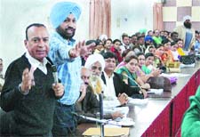 Congress councillors make their point during the MC house meeting in Jalandhar on Friday