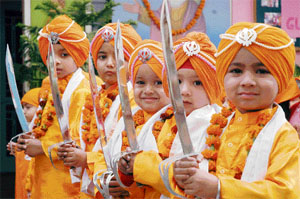 Tiny tots dressed up as Panj Piaras during a nagar kirtan in Ludhiana on Friday.