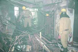 Firefighters try to douse the fire at Paryavaran Bhawan in the Capital on Sunday. 