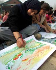 Over 300 students draw on different themes at an art competition organised by the Jammu and Kashmir Alloha at Bakshi Stadium in Srinagar on Sunday. 