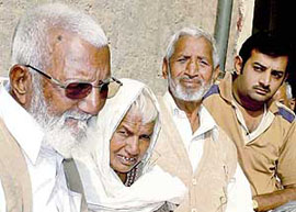 Eightyfive-year-old Mohammad Ramzan shares an emotional moment with his sister Gafurana (75), younger brother Pir Bakash and nephew Zahid Khan at Mohi Khurd village in Patiala.