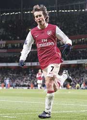 Arsenals Tomas Rosicky celebrates after scoring a goal against Wigan during their English Premier League soccer match on Saturday. Arsenal won 2-0. 
