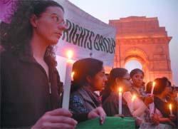 Activists of the Disabled Rights Group hold a candlelight vigil, demanding better facilities for the disabled in the 11th Five Year Plan, at the India Gate in the Capital on Monday. 