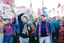 Congress workers raise slogans on The Mall  in Shimla violating the government and court guidelines on Monday; 