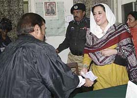 Pakistan's former Prime Minister Benazir Bhutto submits her nomination papers for a national assembly seat to the district sessions judge in her hometown of Larkana