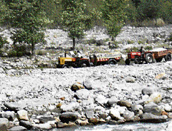 Bajri and boulders being transported from the riverbed opposite Baragram, along the Beas.
