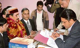 Kangra district BJP president Vipin Parmar files his nomination papers from Sulah at Palampur on Wednesday. 
